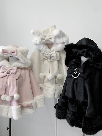 Three cute coats in pink, white, and black with fur trim on a white background