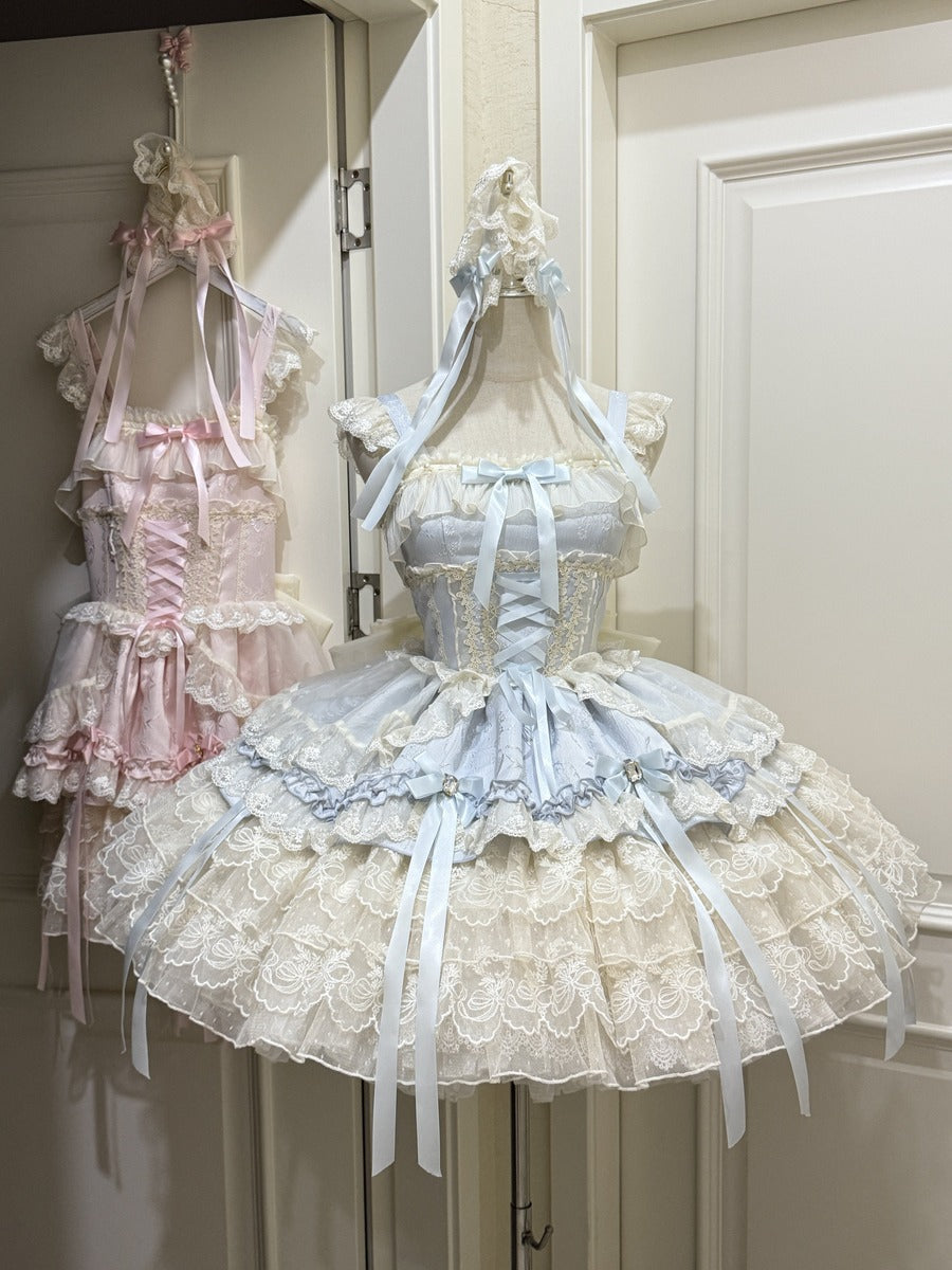 Two pastel-colored dresses on mannequins against a neutral background