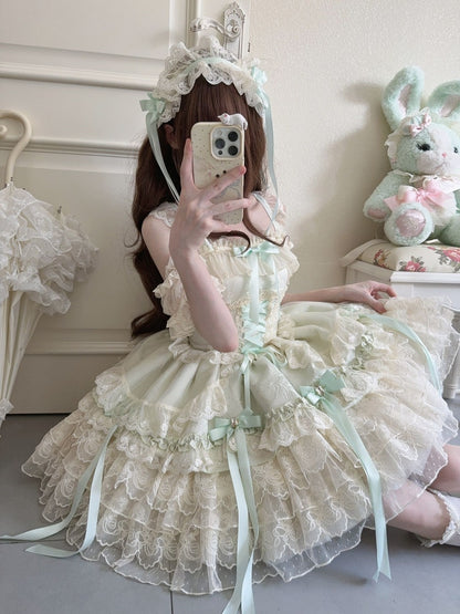 Person wearing a white and green ruffled dress with a fluffy bunny toy in the background.