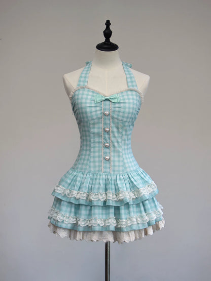 Light blue checkered dress with white lace details on a mannequin against a gray background