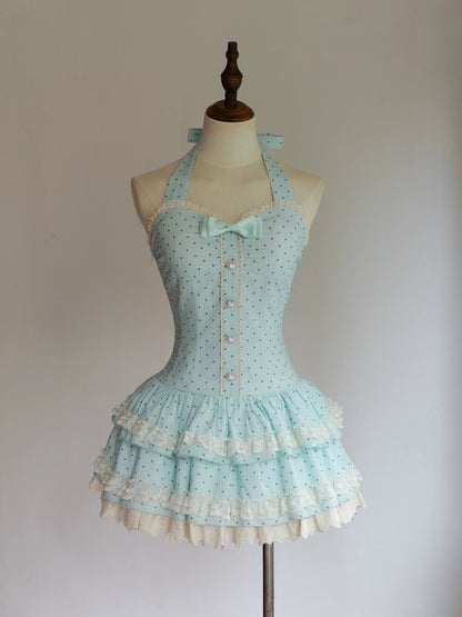 Light blue polka dot dress on a mannequin against a plain background