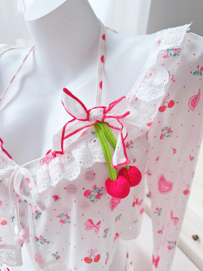 Floral dress with cherry detail on a mannequin