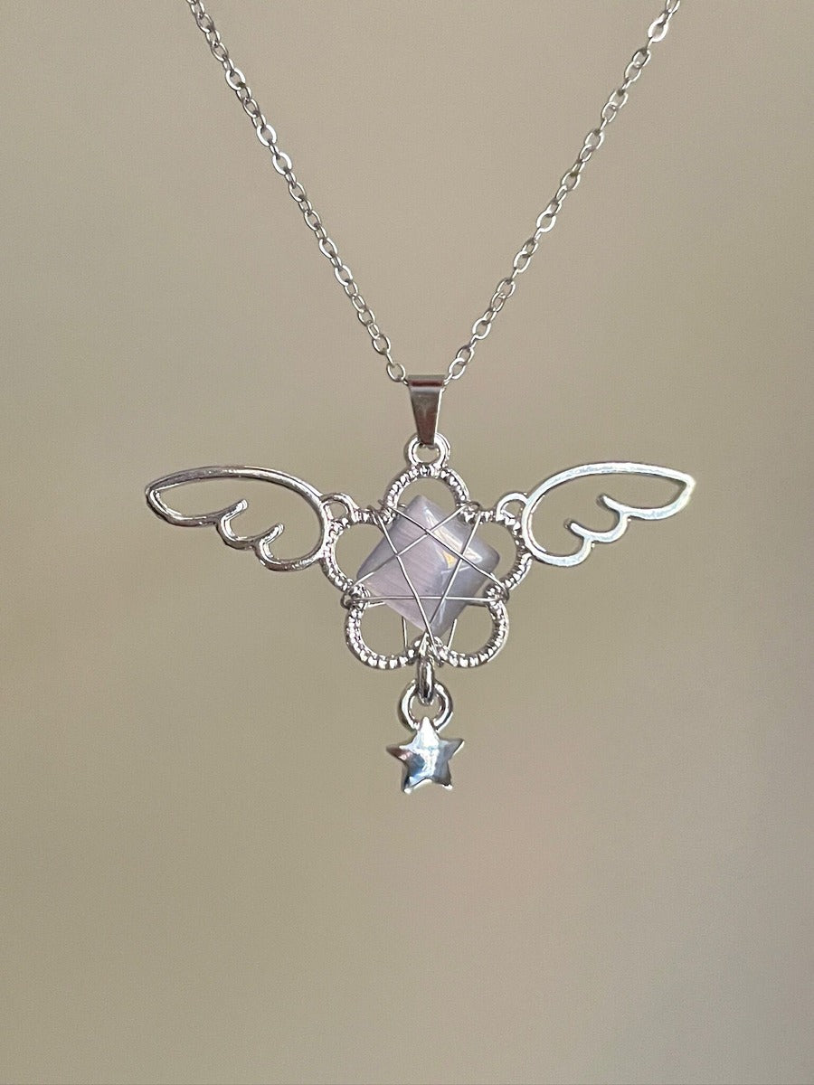 Silver necklace with a decorative pendant on a beige background