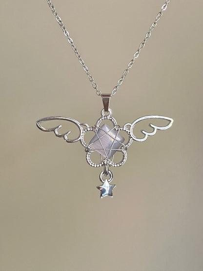 Silver necklace with a decorative pendant on a beige background