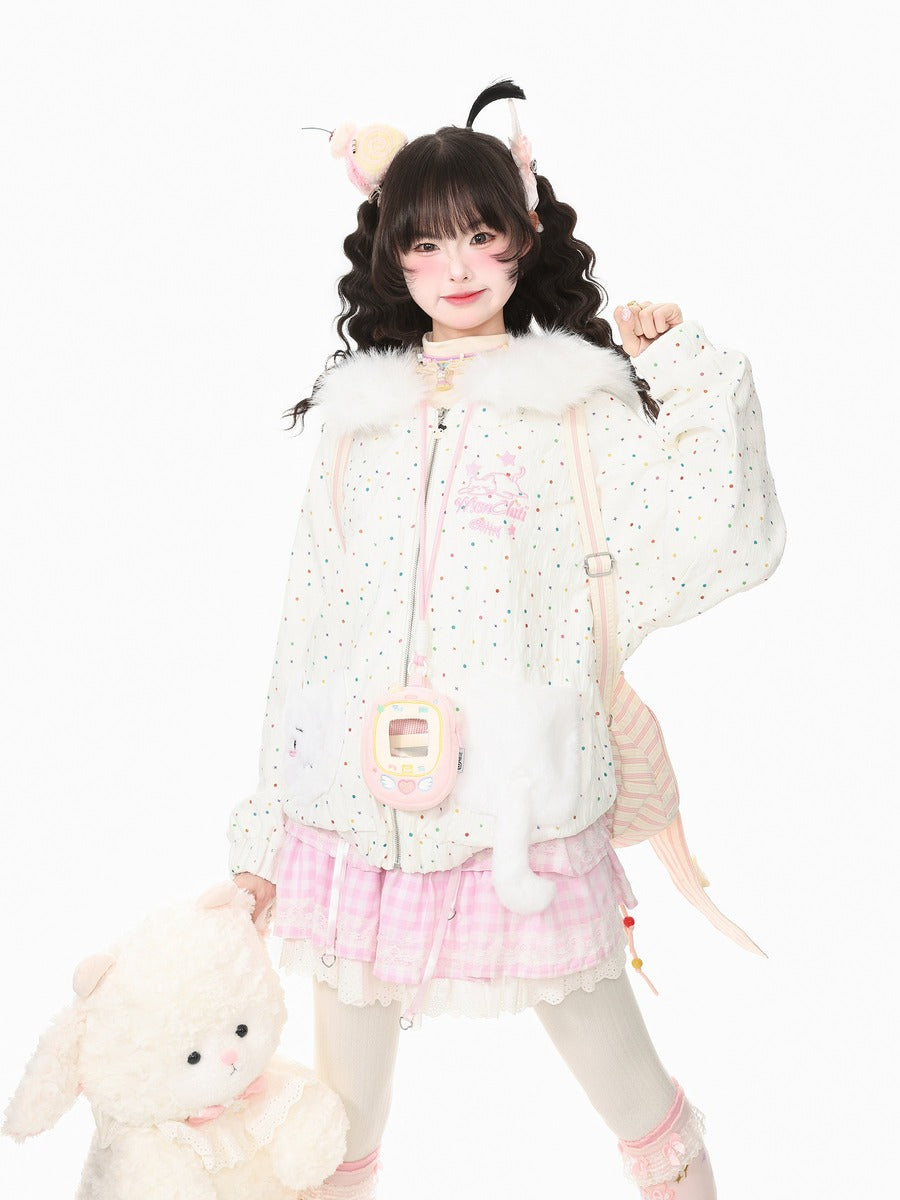 A young woman modeling a cute, pastel-themed outfit consisting of a white jacket with tiny multicolor polka dots and fluffy trim, a pink and white gingham pleated skirt, and a pink striped shoulder bag. She is holding a plush white bunny toy against a solid white background.