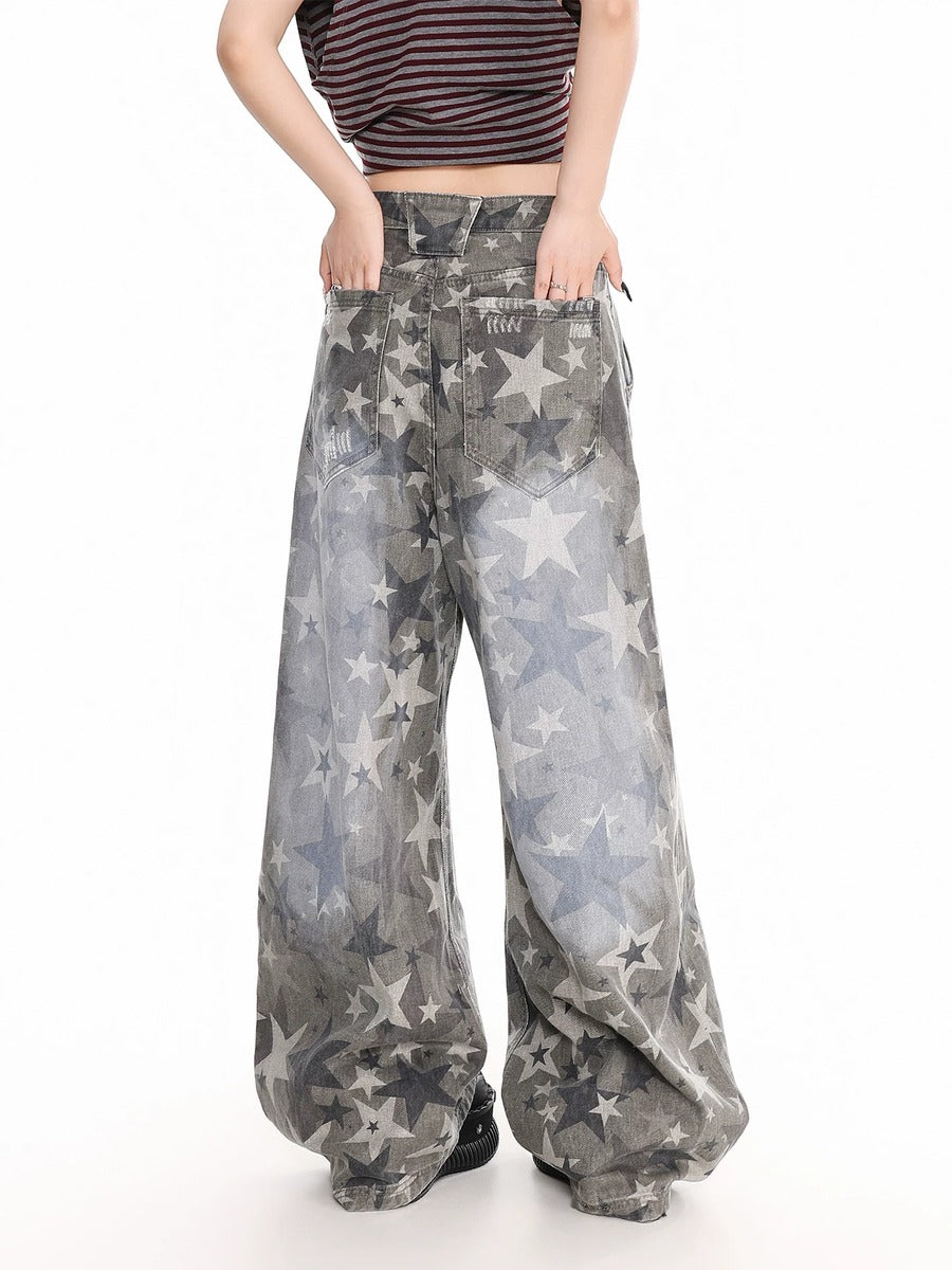 Person wearing star-patterned wide-leg pants on a white background