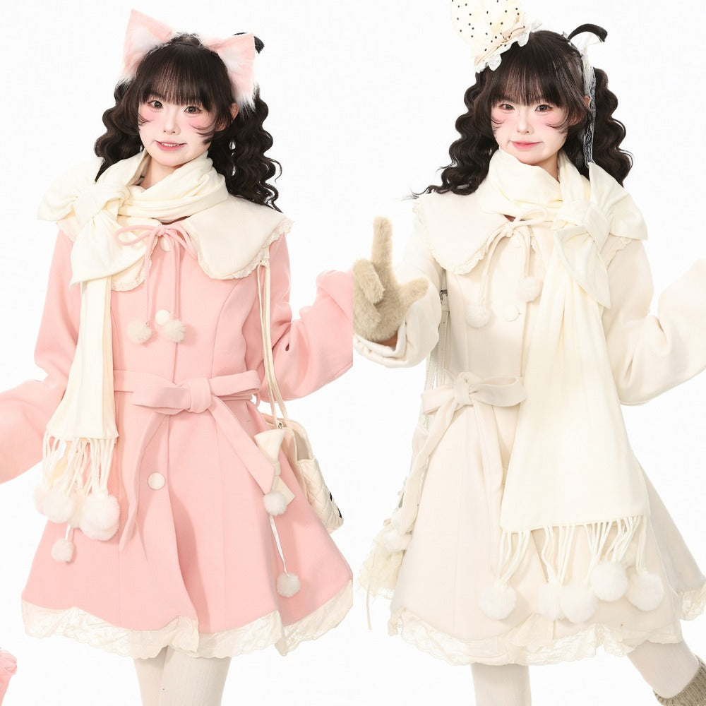 Two models wearing matching Lolita-style winter outfits, one in light pink and one in cream, both with large bow details, fringed scarves, and pom-pom accents against a plain white background.