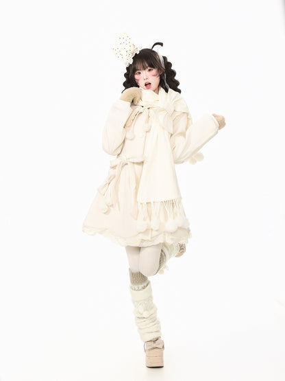 A model wearing a cream-colored Lolita-style outfit, featuring a long-sleeve dress with a large bow, a matching scarf, a decorative headband, and tall knit boot covers, posed against a solid white background.