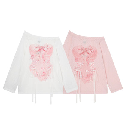 Two long-sleeve off-the-shoulder tops displayed side by side on a white background. The left top is white with a pink lace applique design on the front.