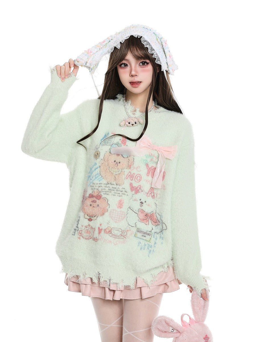 A young woman modeling a pastel mint green fuzzy sweater with a cute cartoon bear graphic and pink bow details, paired with a matching ruffled hat and pink skirt, against a plain white background.