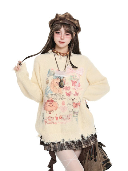 A model wearing a cream-colored, fuzzy long-sleeve sweater with a colorful cartoon bear graphic on the front, styled with a brown beret, layered necklaces, and a plaid skirt against a solid white background.