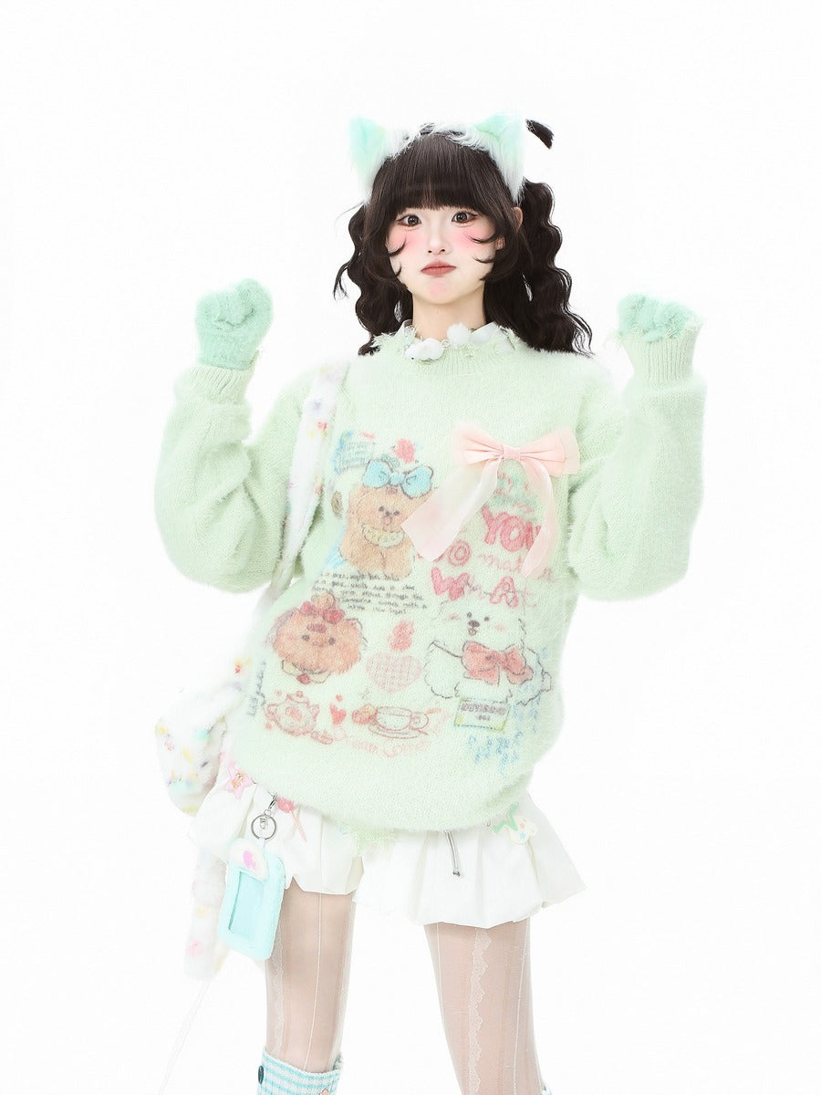 A model wearing a pastel mint green fuzzy sweater with cute cartoon bear prints, a pink bow on the chest, and a white ruffled skirt, posed against a solid white background.