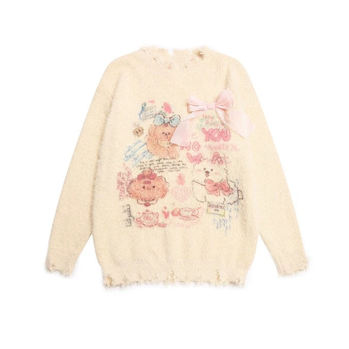 Cream-colored fuzzy long-sleeve sweater with a distressed hem, featuring a cute cartoon bear graphic, pink bow detail, and heart patterns on the front.