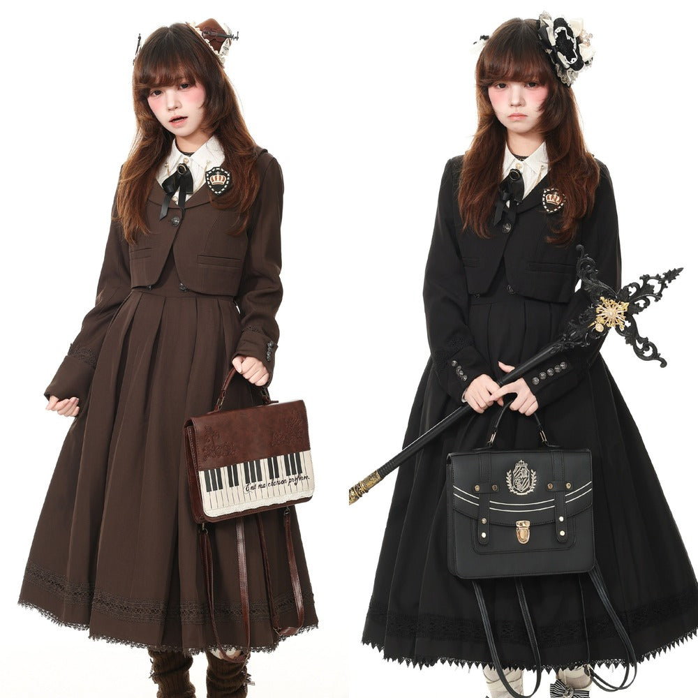 Two models wearing Victorian-style Lolita dresses, one in dark brown and one in black, both featuring long pleated skirts, structured jackets, white collars, and black bows. The model on the left holds a brown piano-key handbag, and the model on the right holds a black decorative staff with a matching black satchel.