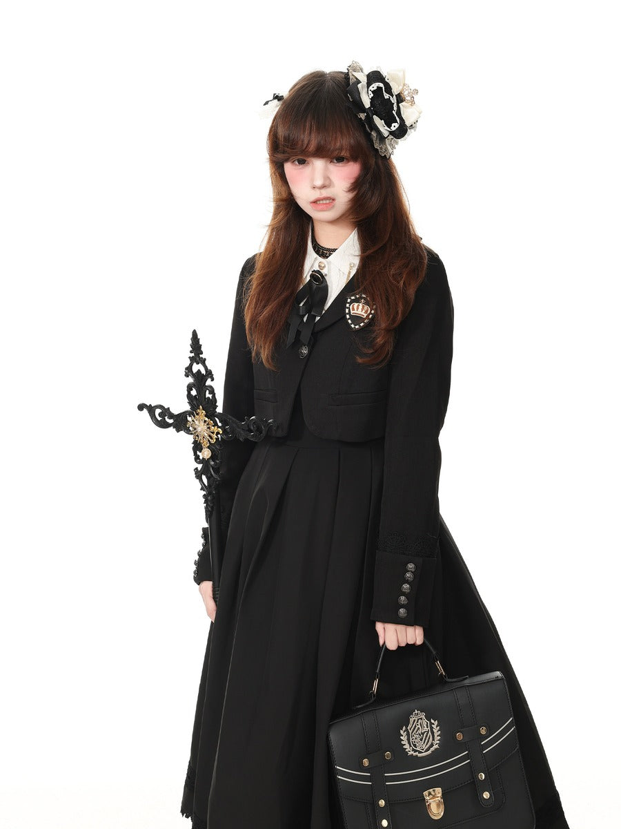 A model wearing a black Victorian-style Lolita dress with a white collar, black bow, and gold brooch, holding a black handbag and a decorative black and gold dagger, on a white background.