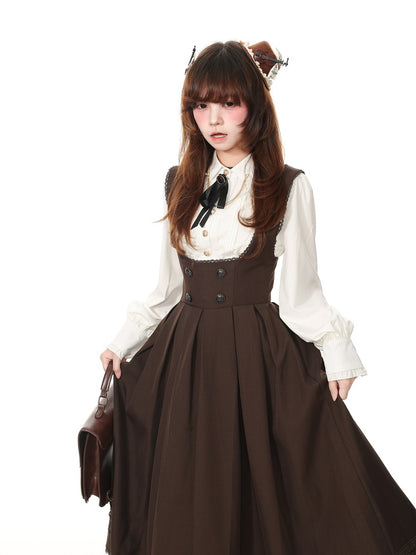 A young woman modeling a brown and white Victorian-style Lolita dress with a high-waisted brown corset bodice, a long pleated brown skirt, and a white long-sleeve blouse with a black bow. She is holding a brown leather handbag against a solid white background.