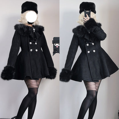 A split-view mirror selfie showing a model wearing a short black coat with a large black fur-trimmed collar, matching black hat, black tights, and striped stockings against a plain indoor wall.