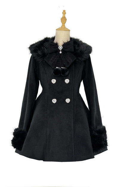 A black double-breasted coat with faux fur trim on the collar and cuffs, displayed on a dress form mannequin against a white background.