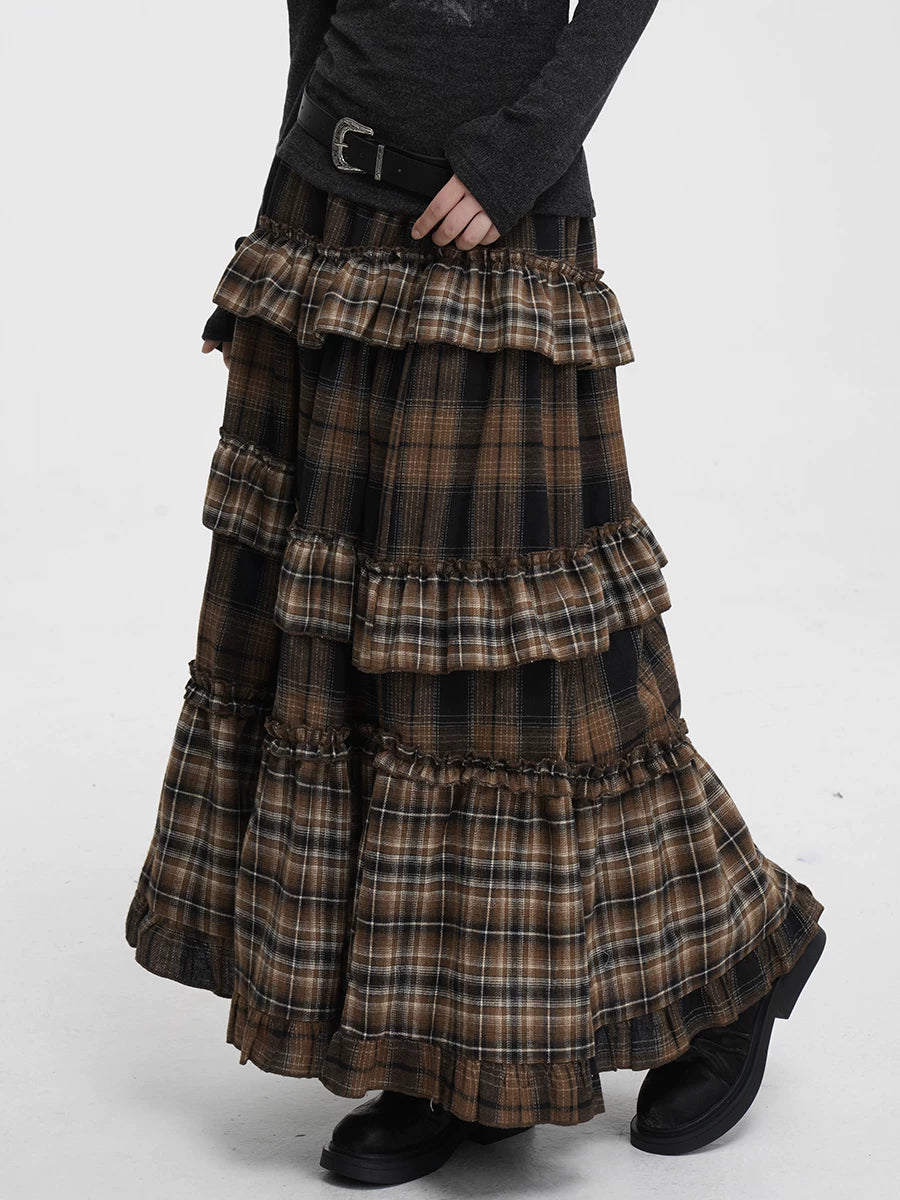 Long plaid skirt with tiered layers on a white background
