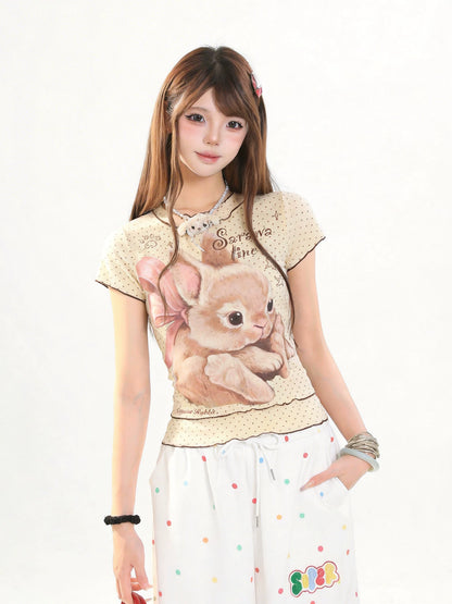 Woman wearing a t-shirt with a cartoon bunny design on a white background