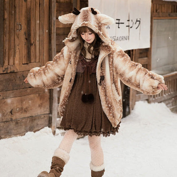 Person wearing a fluffy cute lolita style deer animal-themed coat in the snow