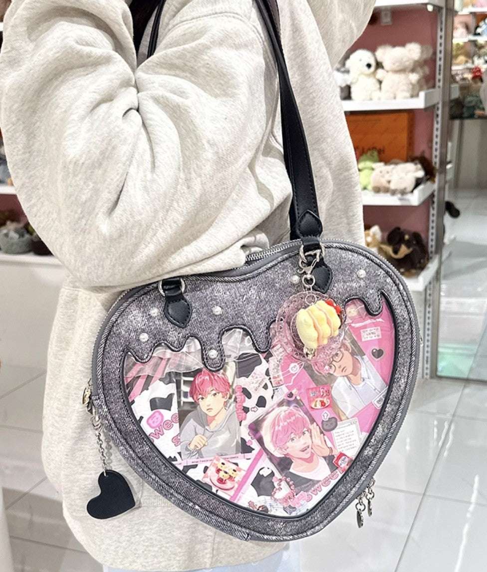 Heart-shaped bag with anime character design worn by a person in a store setting