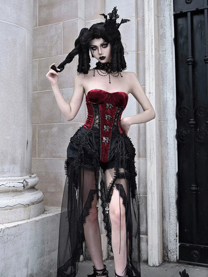 Person wearing a gothic-style outfit with a red corset and black skirt in an urban setting.