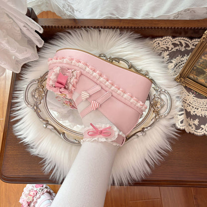 Pink lace-up boot with decorative elements on a fluffy white surface.