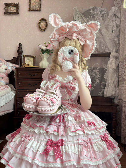 Person in a pink and white ruffled dress with bunny ears in a vintage-style room.