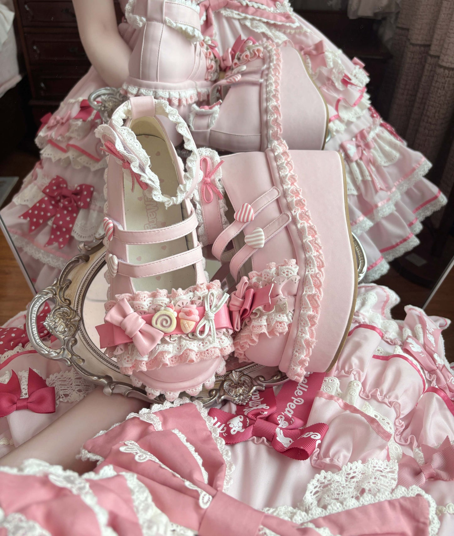 Detailed view of a pink and white lace-up shoe with decorative elements.