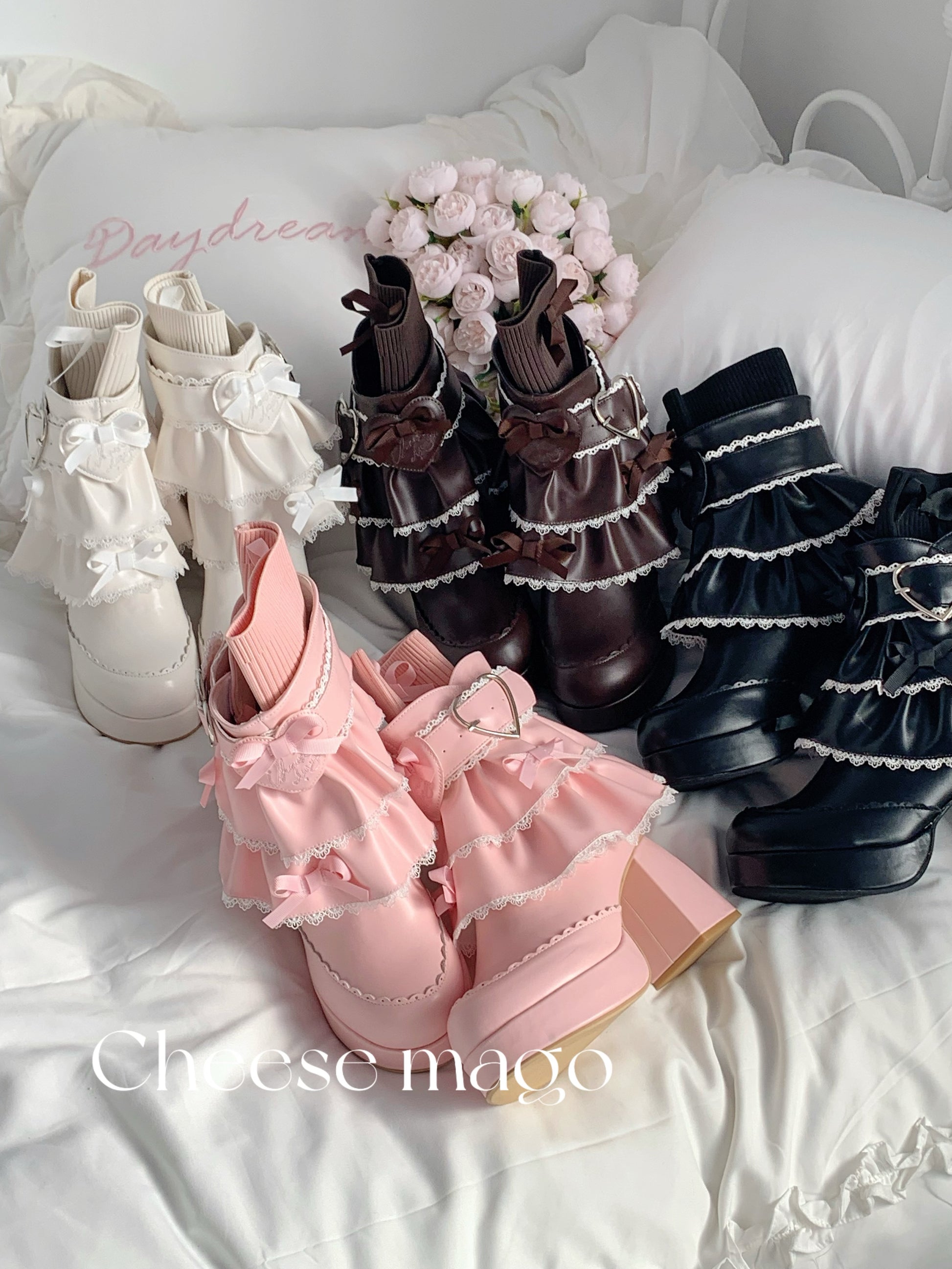 Set of ruffled shoes in white, brown, and black on a white surface with 'Cheese mago' branding.