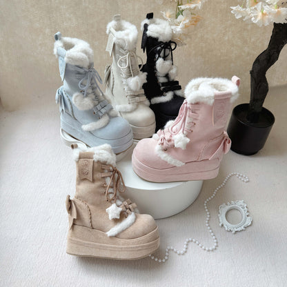 Set of pastel-colored boots with fluffy tops on a light surface.