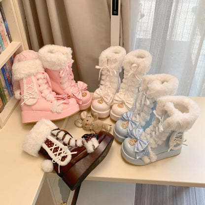 Four pairs of decorative boots with fluffy tops on a table.