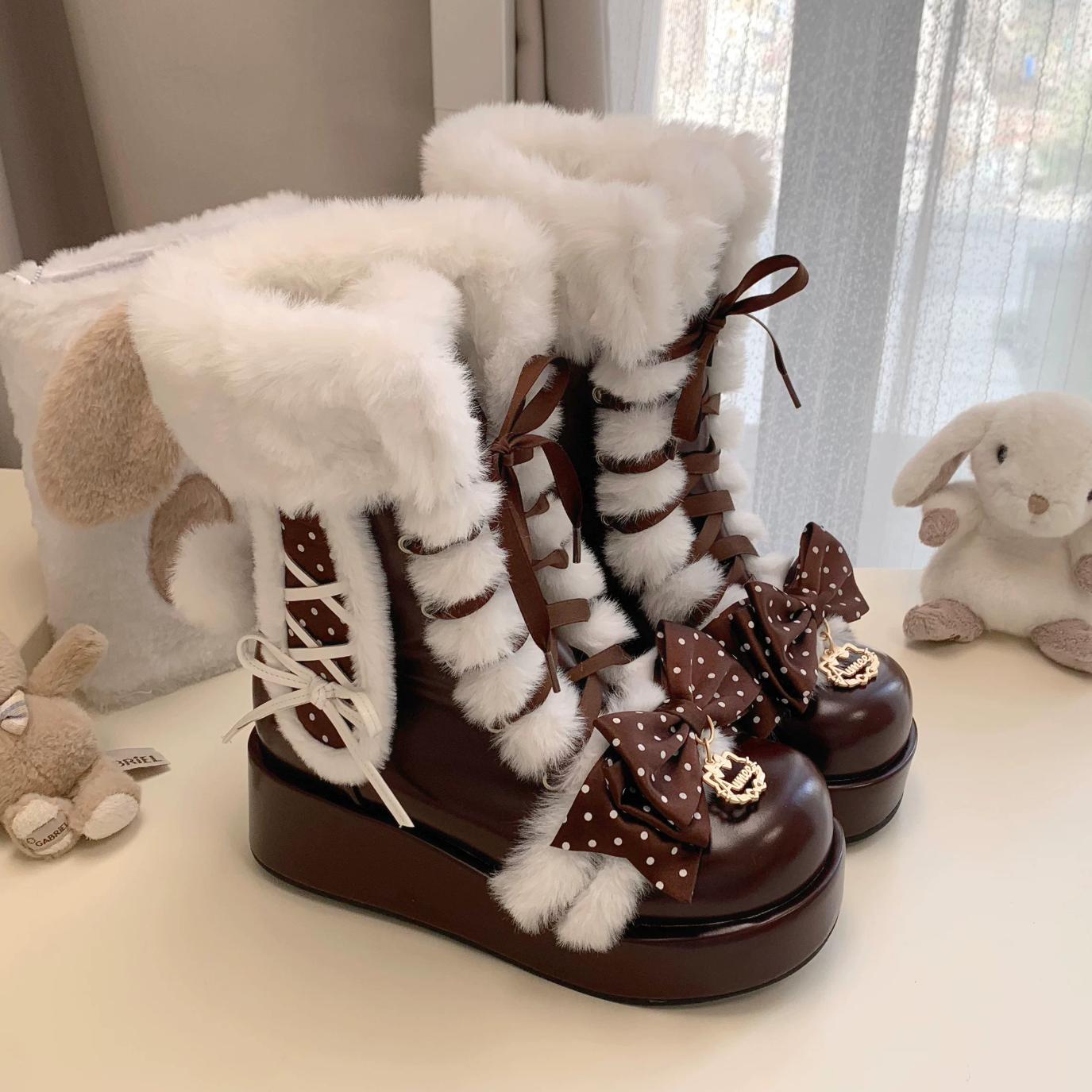 Brown platform boots with white fur and decorative bows on a light surface.