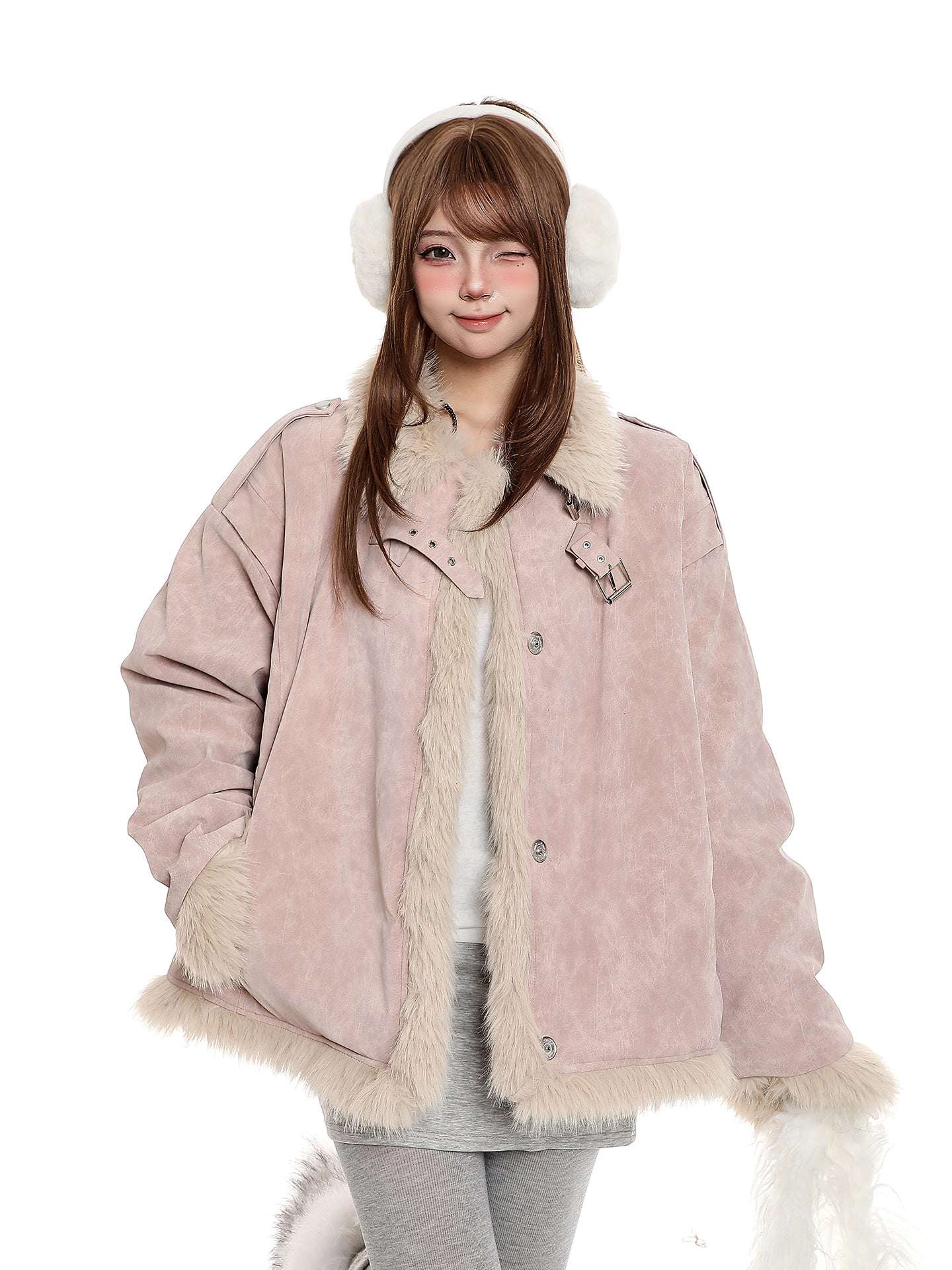 Person wearing a pink coat with fur trim and white earmuffs on a white background