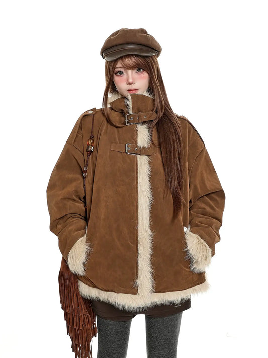Person wearing a brown coat with fur trim and a matching hat on a white background