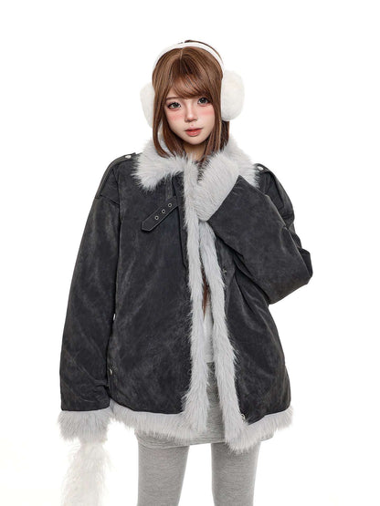 Person wearing a dark gray coat with white fur trim and matching white earmuffs on a white background