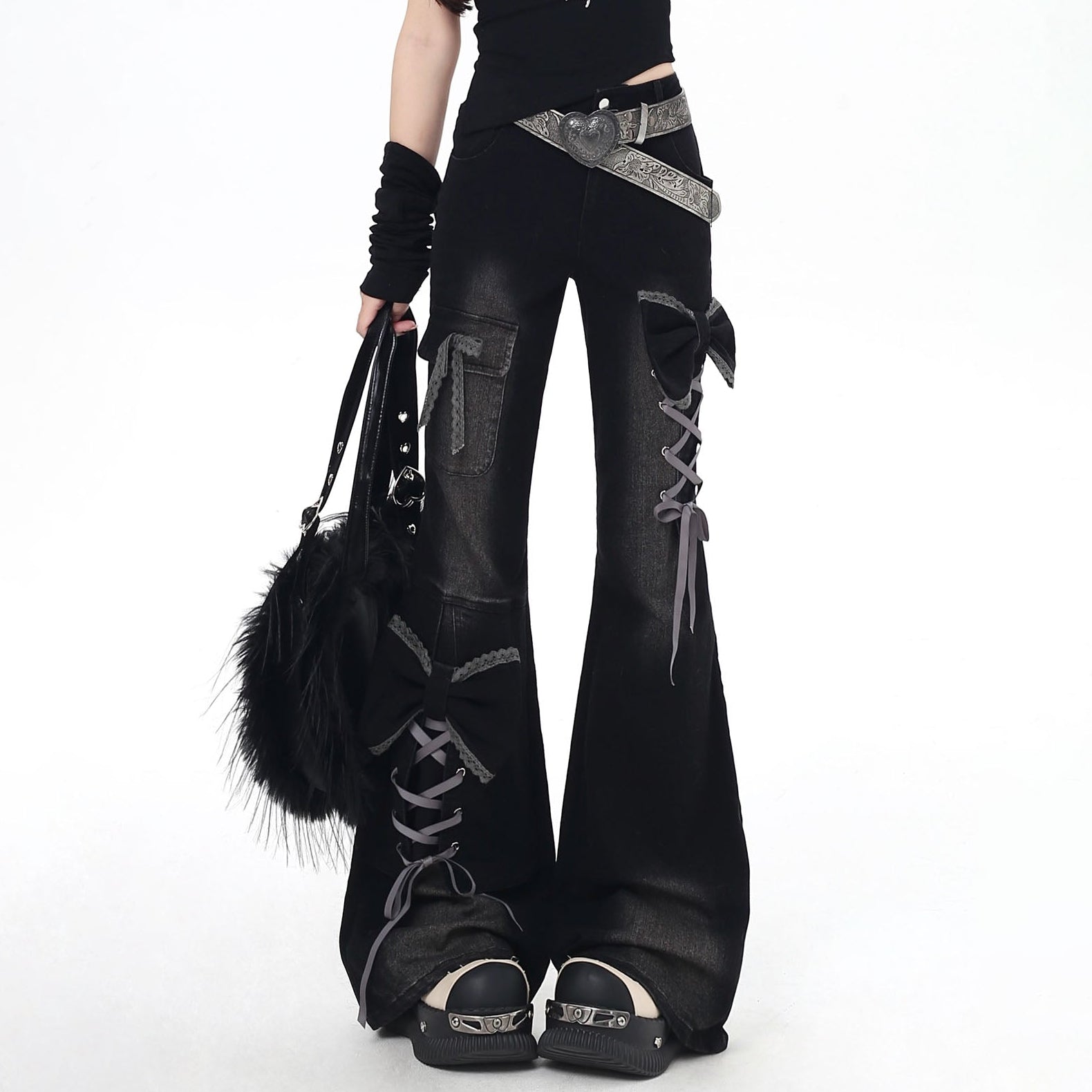 Black gothic-style pants with lace-up design on a white background