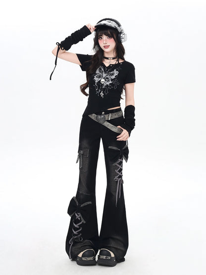 Person wearing a black outfit with lace-up details on a white background