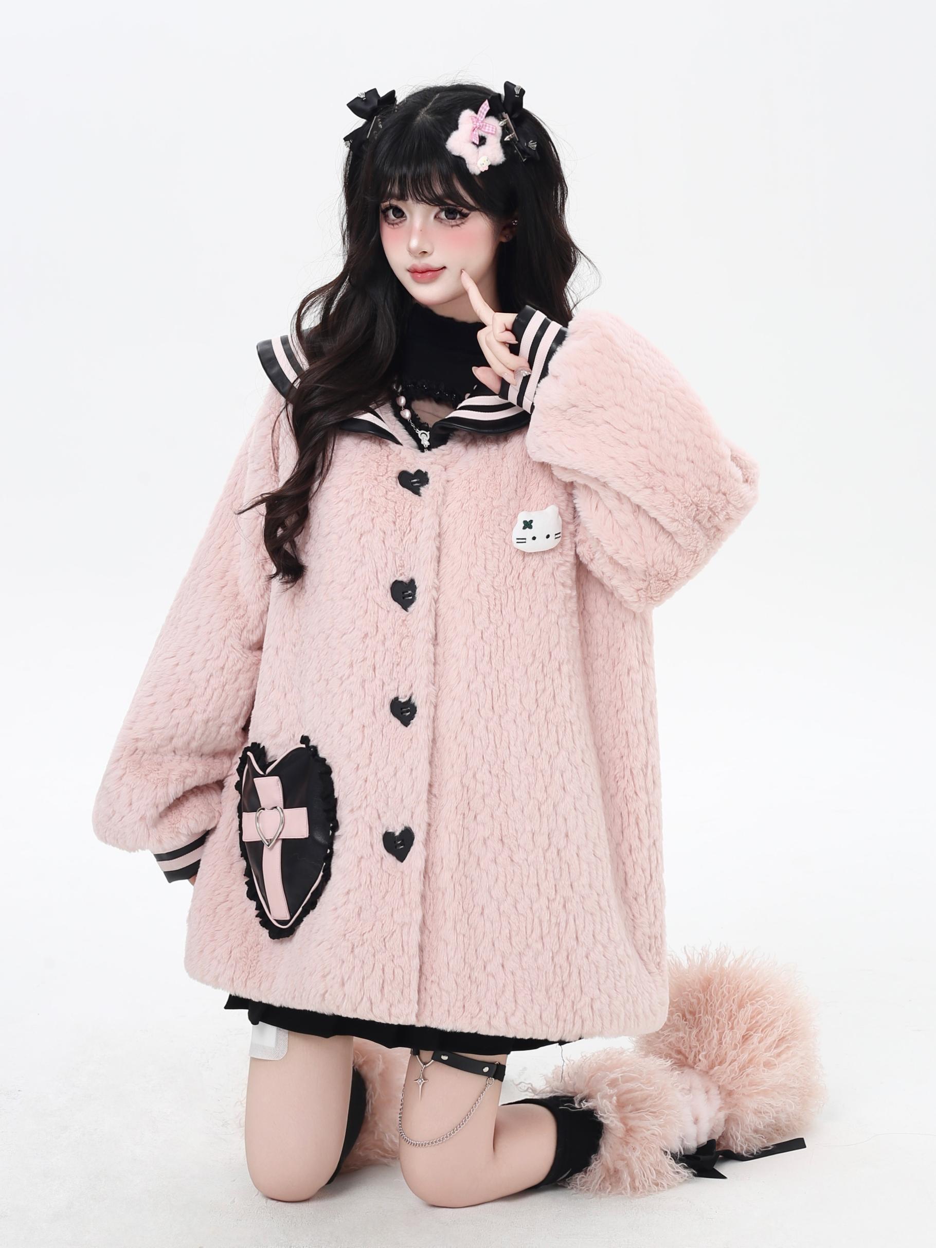 Person wearing a pink fluffy coat with black accents on a white background