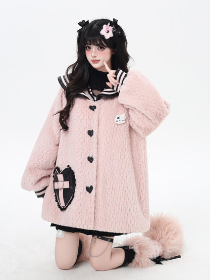 Person wearing a pink fluffy coat with black accents on a white background