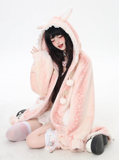 Person wearing a pink plushie costume with bunny ears on a white background