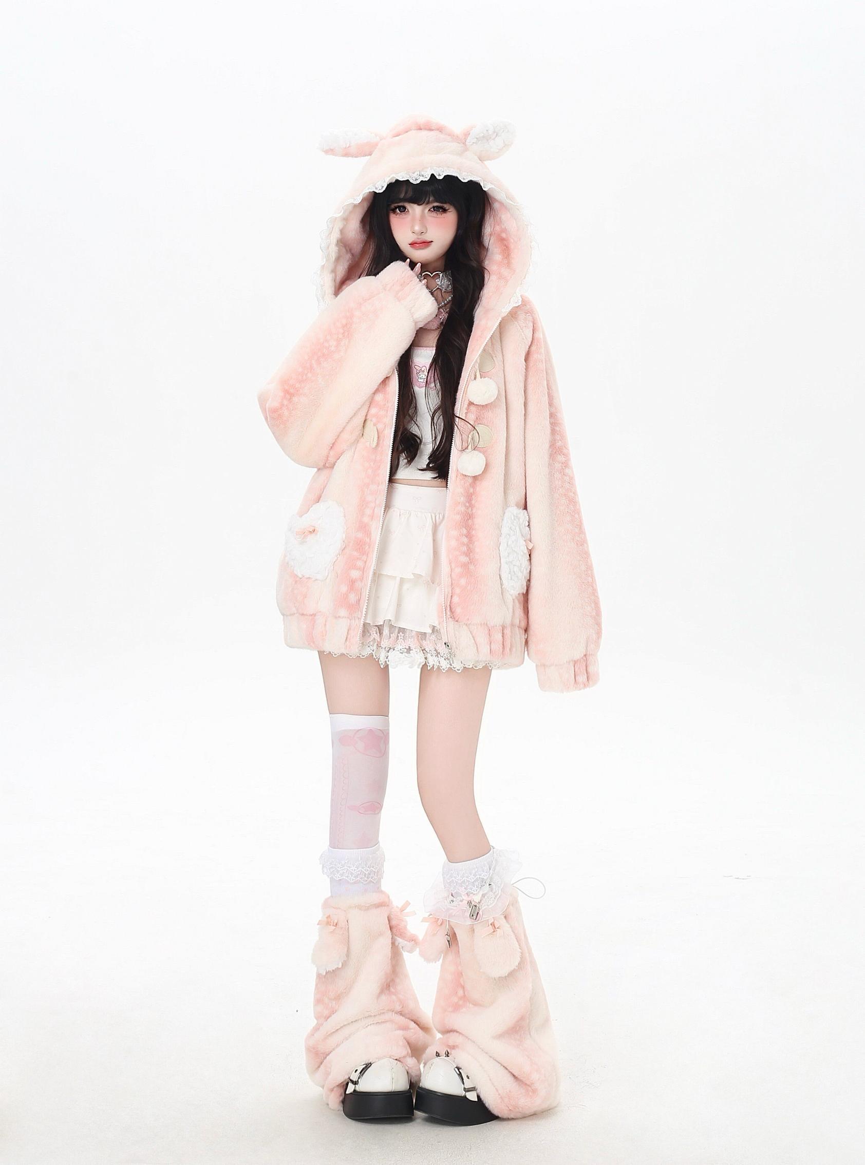 Person wearing a pink fluffy deer outfit with bunny ears on a white background