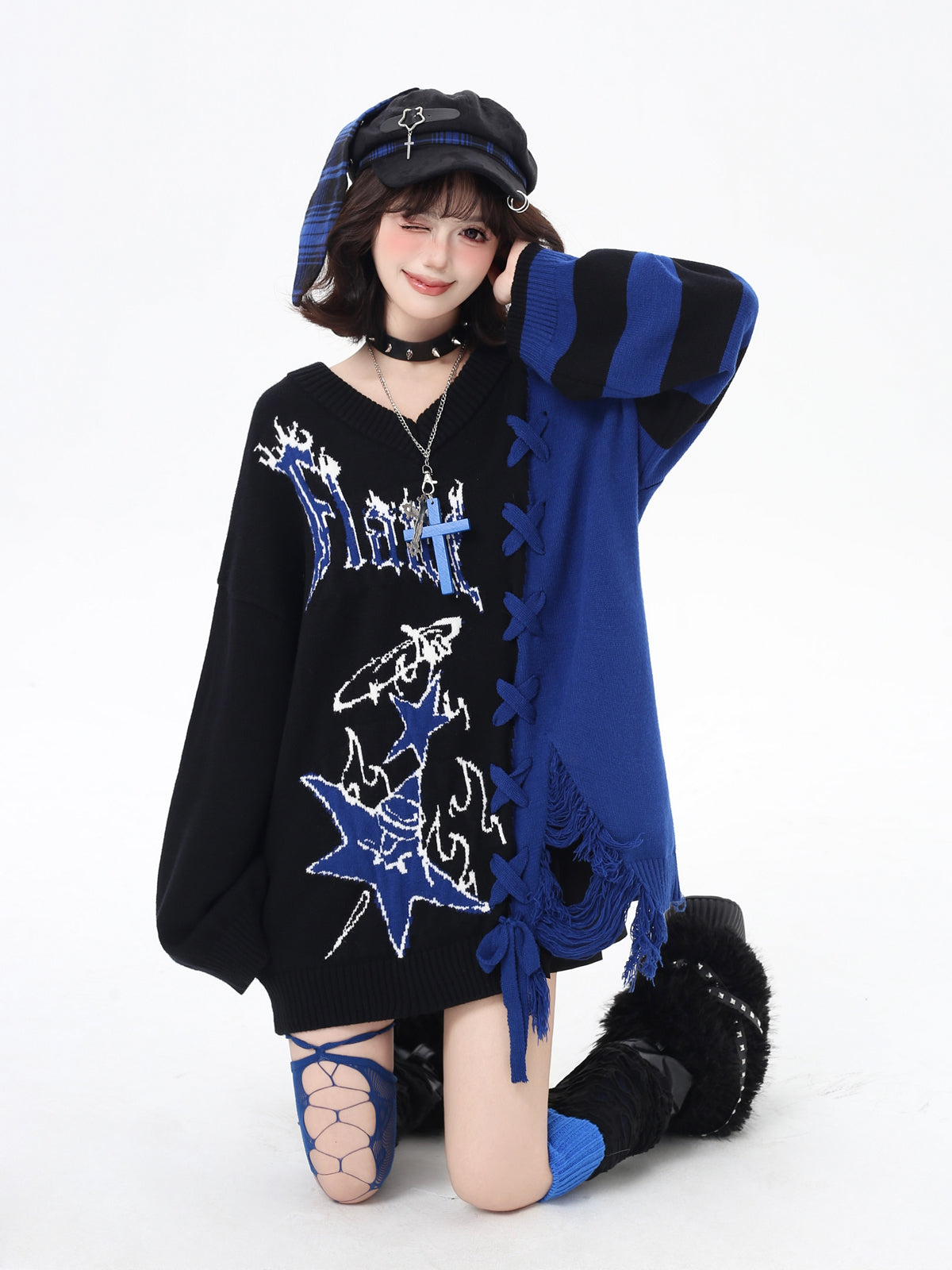 Person wearing a black and blue outfit with star designs on a white background