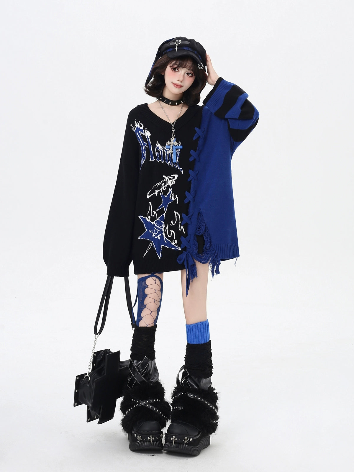 Person wearing a black and blue outfit with graphic design on a white background