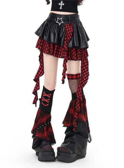 Gothic-style outfit with plaid skirt and boots on a white background