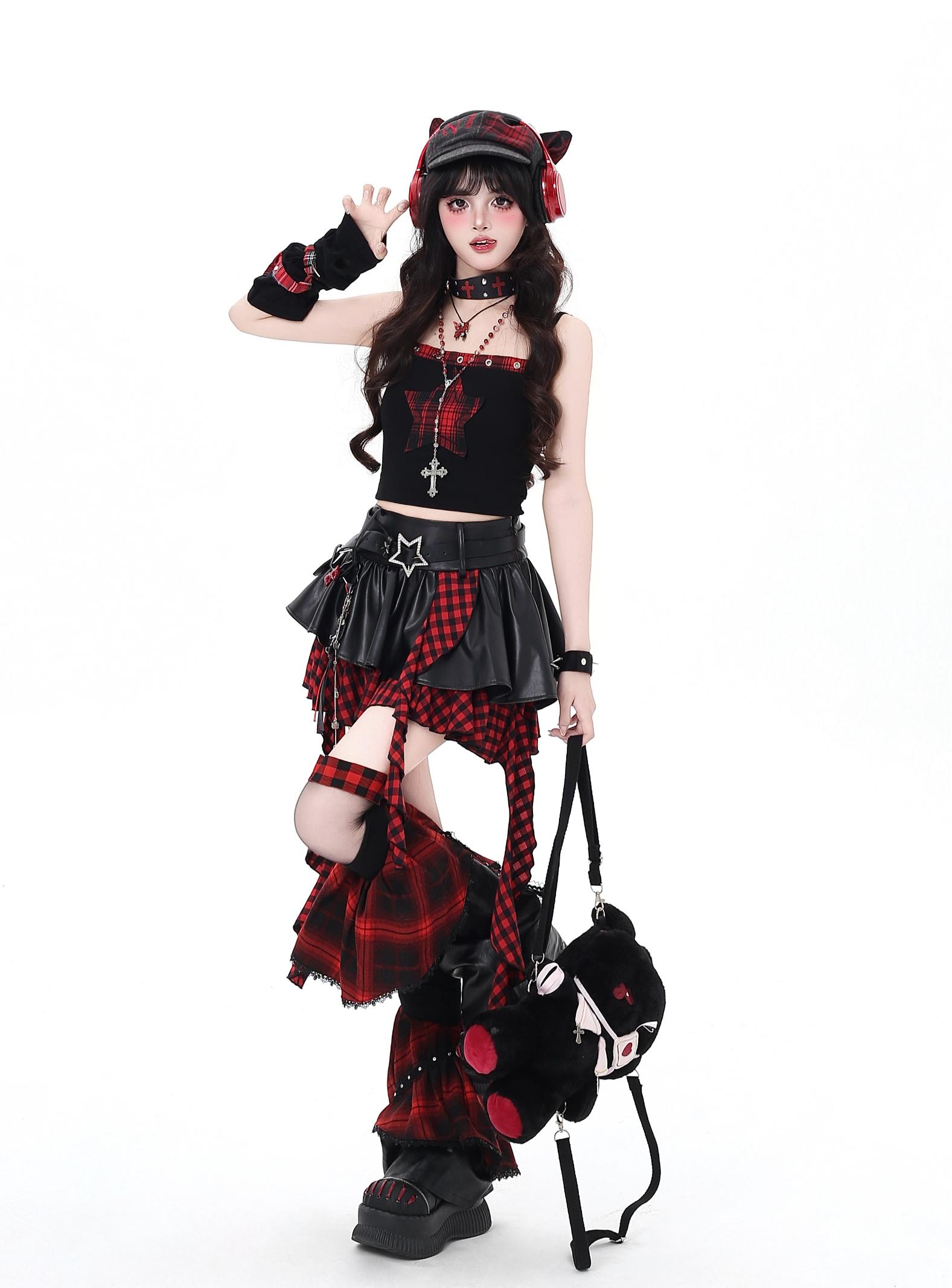 Person wearing a black and red plaid outfit with cat ears on a white background