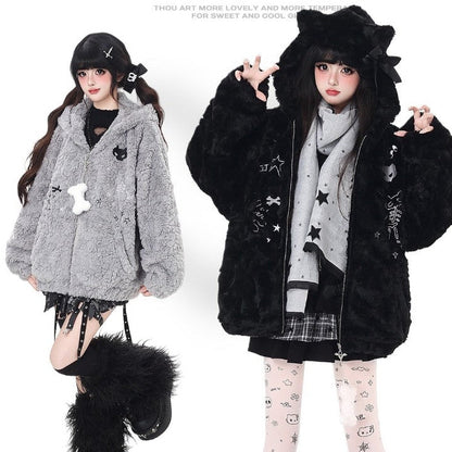 Two people wearing fluffy jackets with star and cat designs on a white background.