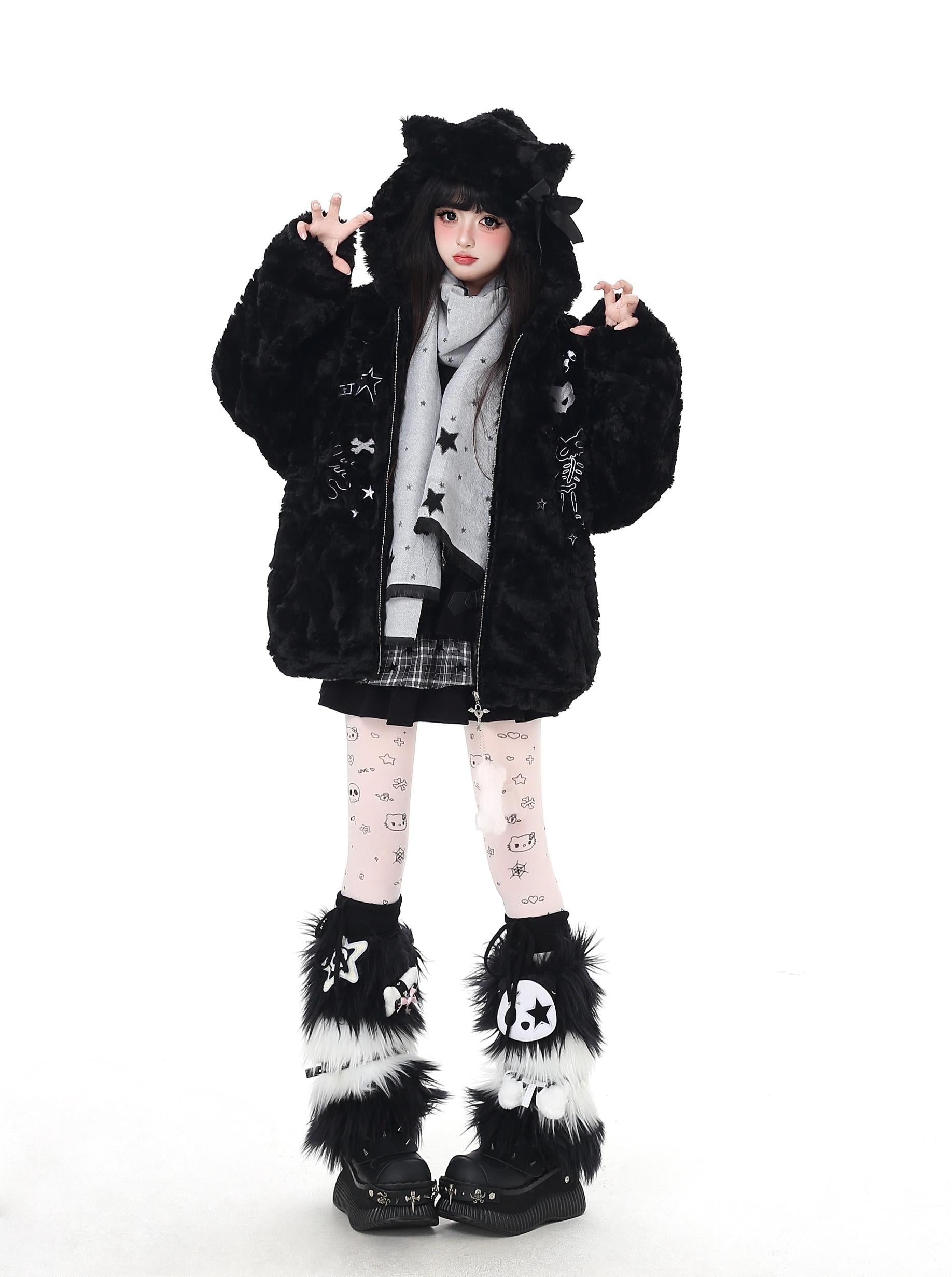 Person wearing a black fur-lined coat with star patterns on a white background