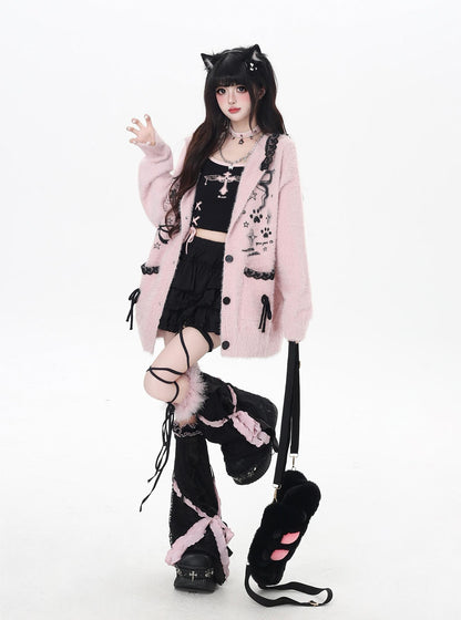 Person wearing a pink coat with cat ears, black skirt, and black shoes on a white background